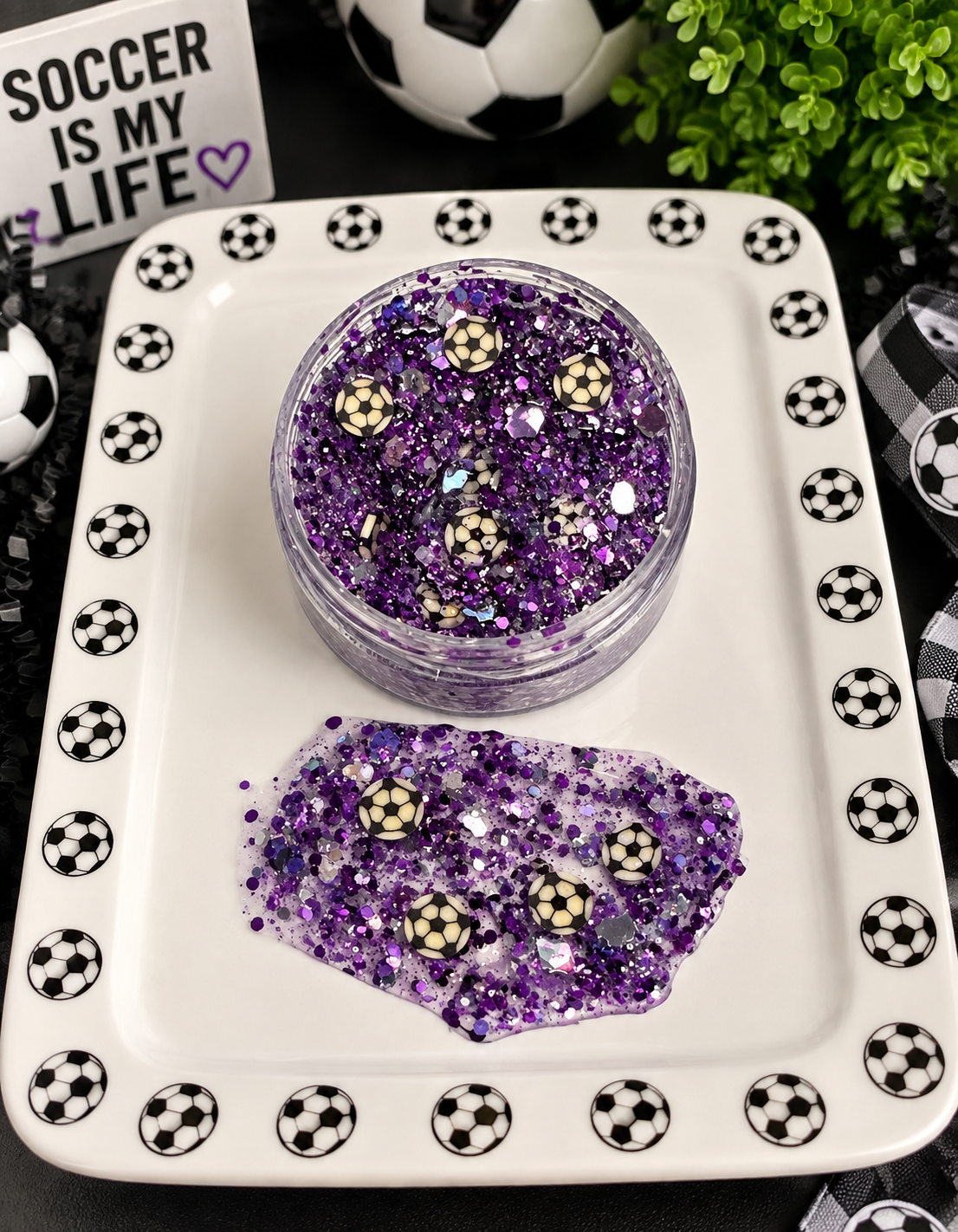 Purple and silver chunky glitter with tiny soccer ball confetti in a jar on a soccer-themed tray